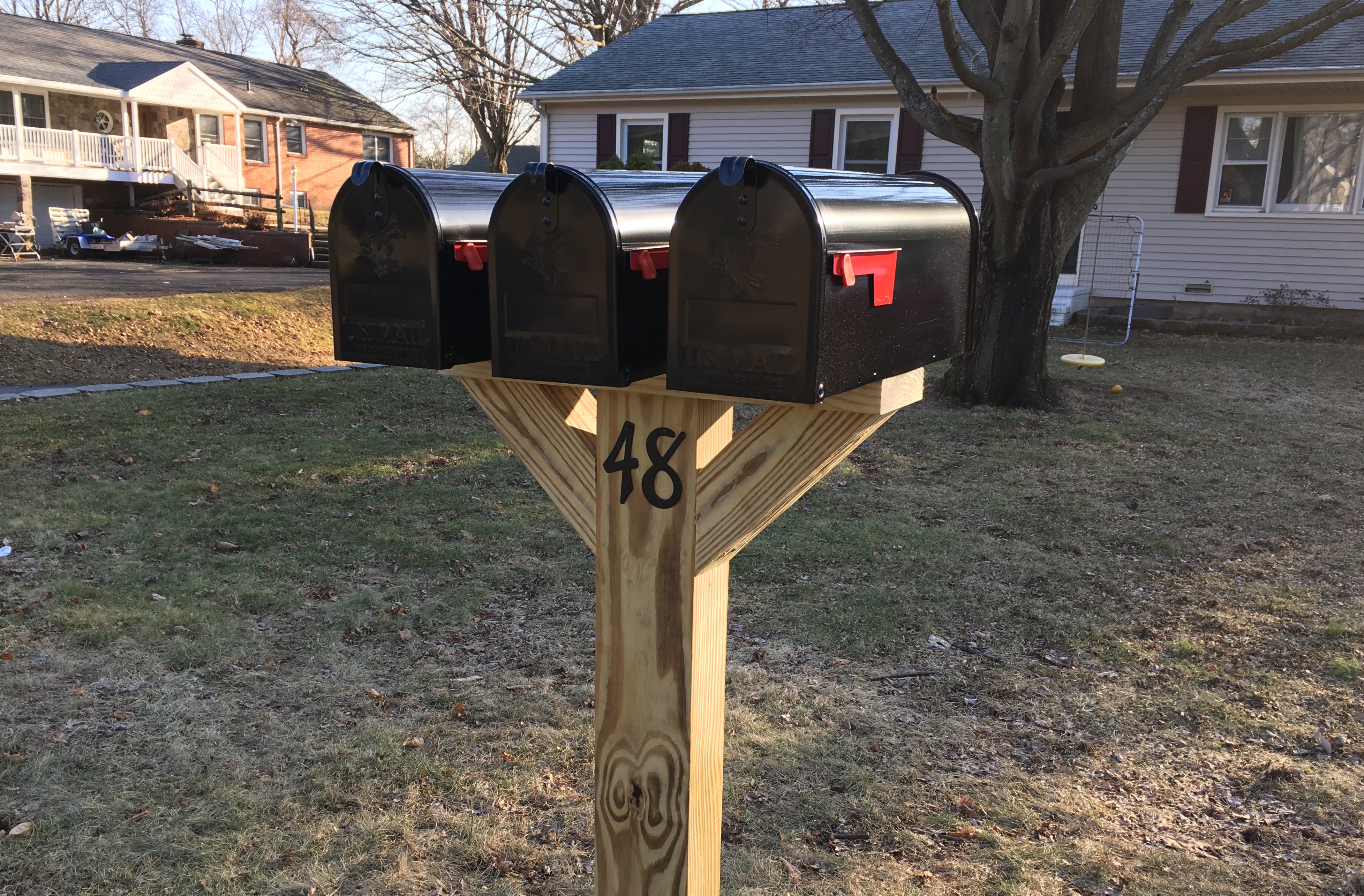 Three Mailboxes on a Post