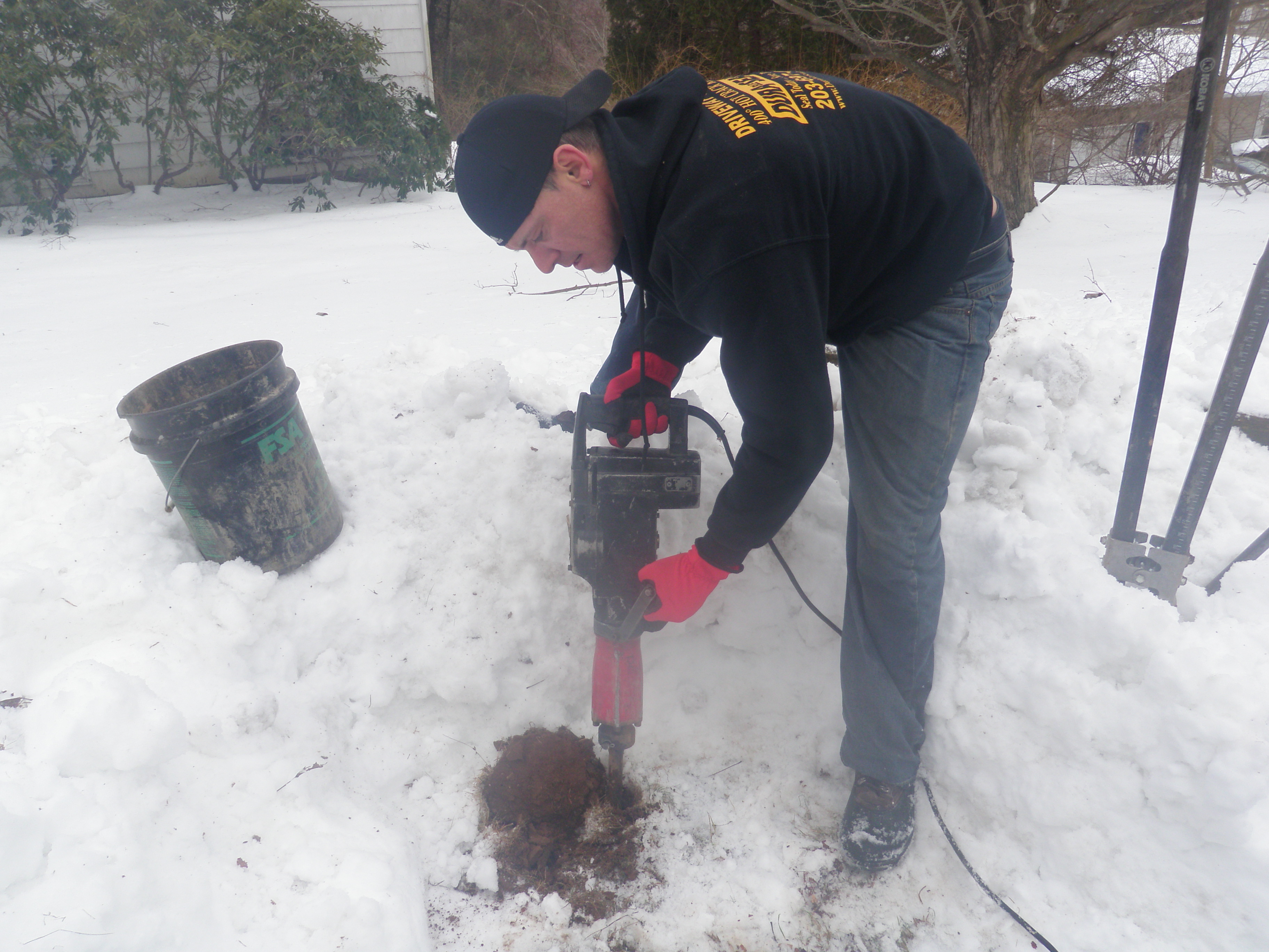 Digging New Hole for Mailbox Post with Hammer Tool