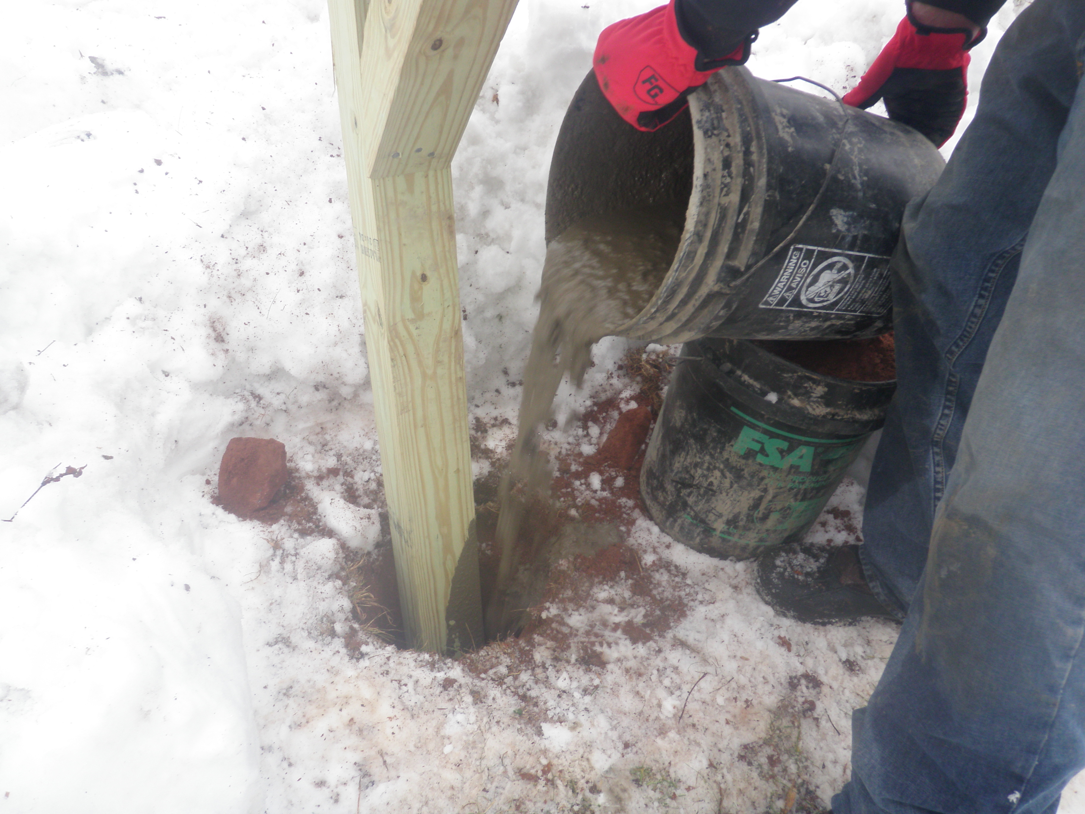 Pouring Concrete into Mailbox Post Hole